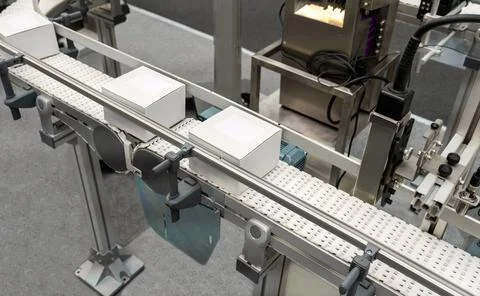 High angle view of packed white cardboard boxes on a production line in a fac Stock Photos
