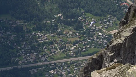 High angle view of paragliders over a town Stock Footage 124413761