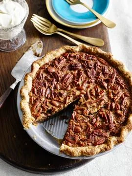High angle view of pecan pie with slice missing Stock Photos