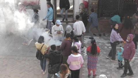 High angle view of people burning incense and others doing the Kora. 스톡 동영상 241736106