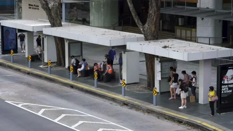 High angle view of people at bus stop, Scotts Road. Stock Footage 138372931