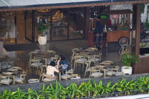 High angle view of people dining at an outdoor restaurant terrace. 스톡 사진