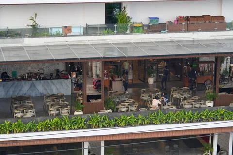 High angle view of people dining at an outdoor restaurant terrace. Stockfoto's