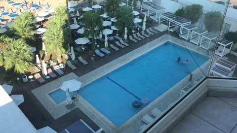 High Angle View Of People In A Hotel's Swimming Pool Stock Footage 169577842