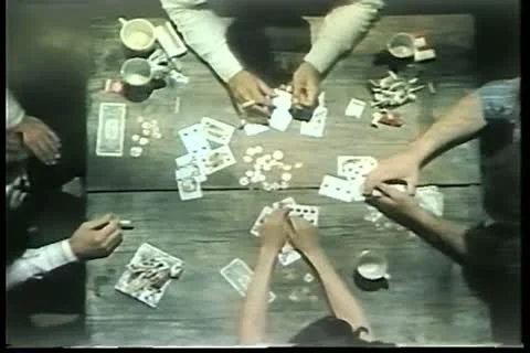 High angle view of people playing cards on wooden table Stock-Footage 11354225