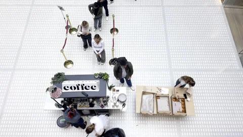 High Angle View of People Queuing at an Indoor Coffee Stand Stock Footage 346726649