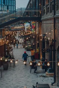 High angle view of people walking past the shops in Coal Drops Yard, London,  Stock Photos