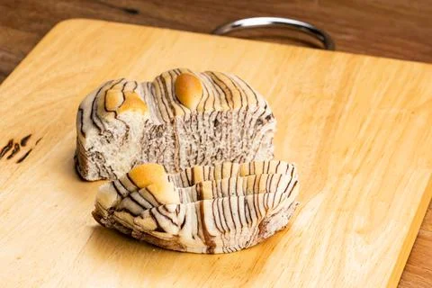 High angle view of piece and sliced of Chocolate Flavored Bread. Stock Photos