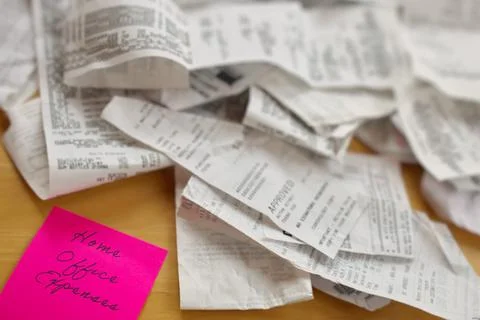 High Angle View of Pile of Receipts with Home Office Expenses Pink Sticky Note Stock Photos