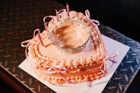 High angle view of a pink heart shaped cake with a luxury princess crown Stock Photos