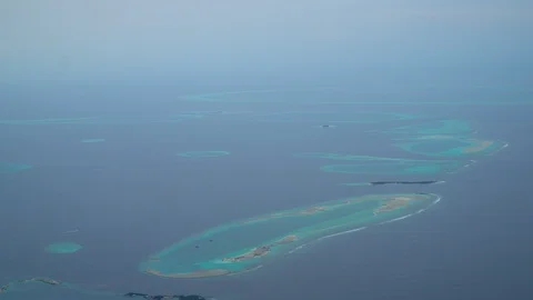 High angle view of the plane looking down to the islands and the sea. Stock Footage 98967503