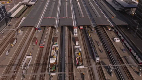 High angle view of platforms at main train station. Traffic on tracks, various Video stock 247469372