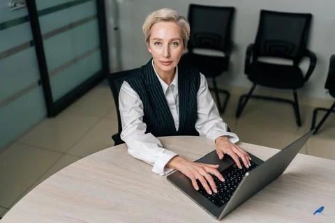 High-angle view portrait of elegance gray-haired middle-aged business woman Stock-Fotos