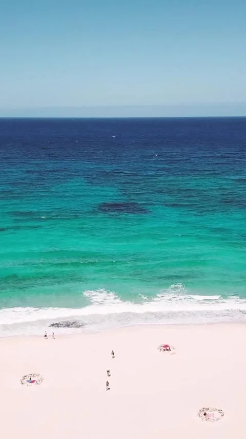 High angle view of a pristine beach with pinkish-white sand and beautiful Stock Footage 344820349