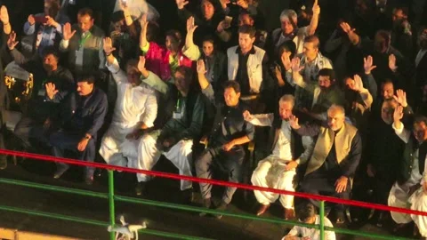 High Angle View Of PTI Party With Imran Khan Sitting Down With Arm In Air Stock Footage 190413204