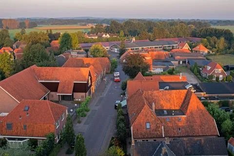 High angle view of public transport bus in street of rural village. Stock Photos