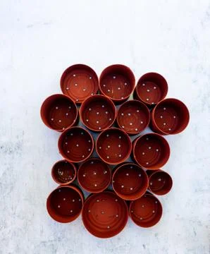 High angle view of red cans in different sizes with holes on the table Stockfoto's