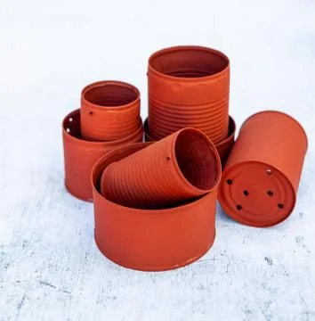 High angle view of red cans in different sizes on the table under the lights Stock Photos