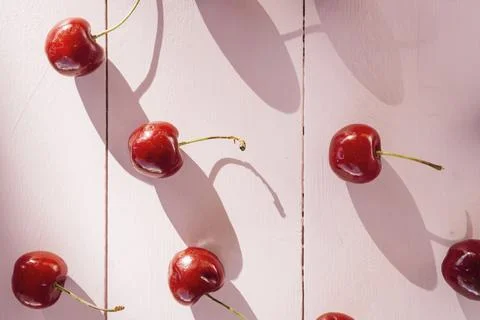 High angle view red cherries wooden plank Stock Photos