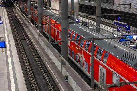 High angle view of red regional train at railway station. Modern public tra.. 스톡 사진