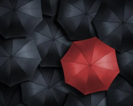 High angle view of red umbrella over many black ones Stock Photos
