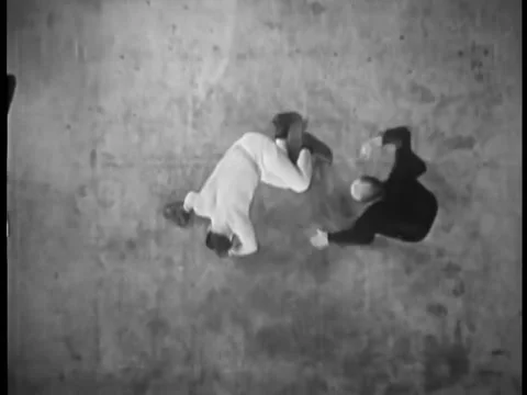 High angle view of referee counting down knockout and declaring winner Stock Footage 260256818