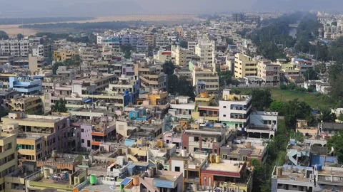 High-angle view revealing a sprawling cityscape with colorful residential h.. Video stock 327946678