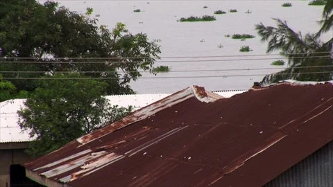 High Angle View Of River Current And Rusty Roof In Badagri, Nigeria Stock Footage 345911020