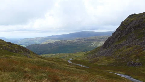 A high angle view of a road between mountains and hills. Stock Footage 127723012