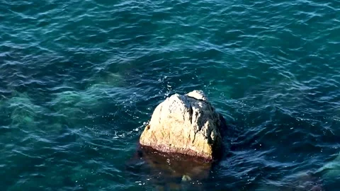 High angle view of a rock in the sea in full HD Video stock 161407627