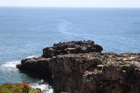 High angle view of rocky cliffs and Atlantic ocean in Cascais, Portugal. Stock Photos