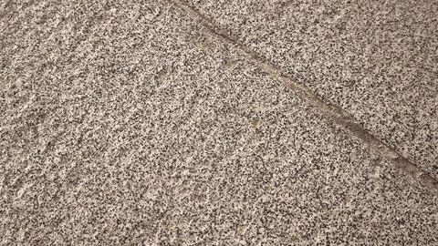 High angle view of rough granite stone pavement texture. Fotos Stock