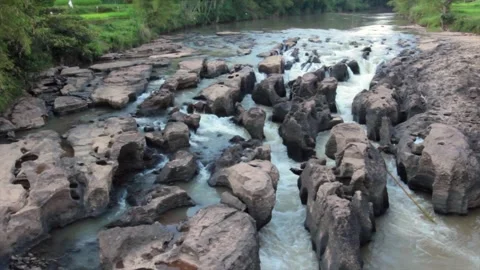 High Angle View of a Scenic River with Unique Rock Formations and Small Waterfal Stock Footage 329502769