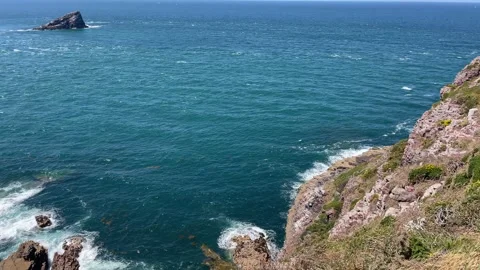 High-Angle View of a Sea Stack and Crashing Waves on the Brittany Coast Stock Footage 314991295