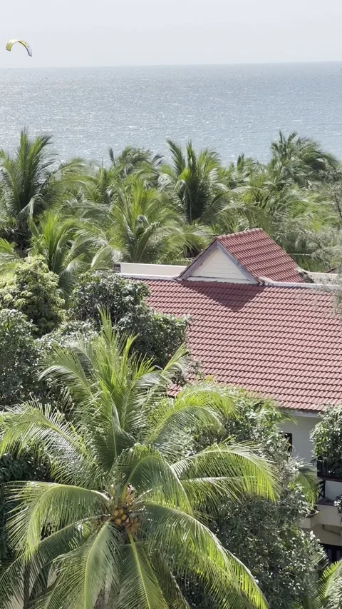 High-angle view of a seaside resort featuring traditional red tile roofs su.. Stock Footage 338020286