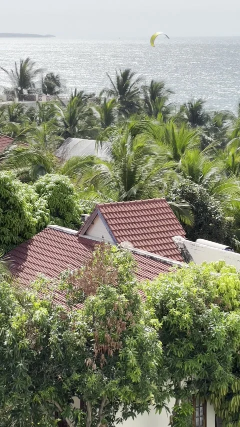High-angle view of a seaside resort featuring traditional red tile roofs su.. Stock Footage 338020314