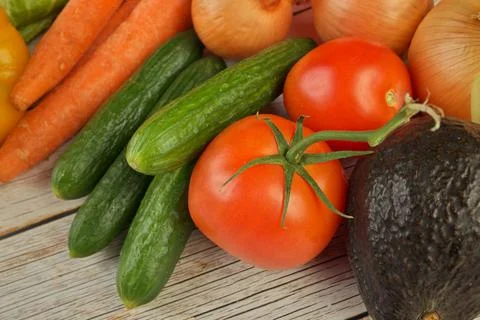 High Angle View of Selection of Fresh Summer Vegetables on a Rustic Wooden Table Stock Photos