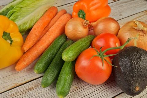 High Angle View of Selection of Fresh Summer Vegetables on a Rustic Wooden Table Stock Photos