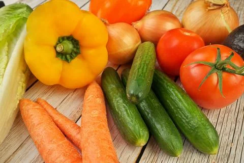 High Angle View of Selection of Fresh Summer Vegetables on a Rustic Wooden Table Stock Photos