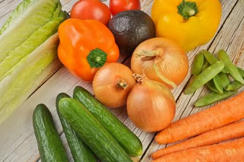High Angle View of Selection of Fresh Summer Vegetables on a Rustic Wooden Table Stock Photos