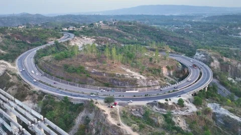 High-angle view of sharp S-curve road and structural pillars. Stock Footage 335645310