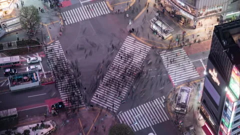 High angle view of Shibuya crossing. 4K night time-lapse, blurred logos Stock Footage 153399036