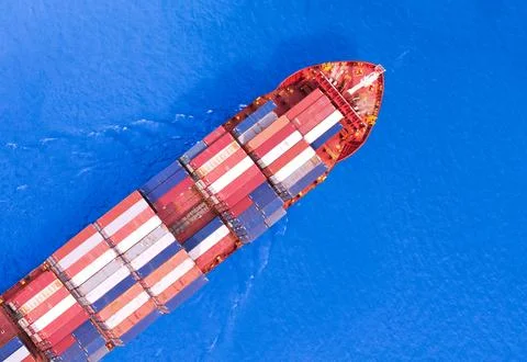 High angle view of the shipping system transport containers by cargo ships,.. Stock Photos