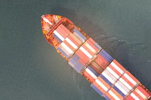 High angle view of the shipping system transport containers by cargo ships,.. Stock Photos