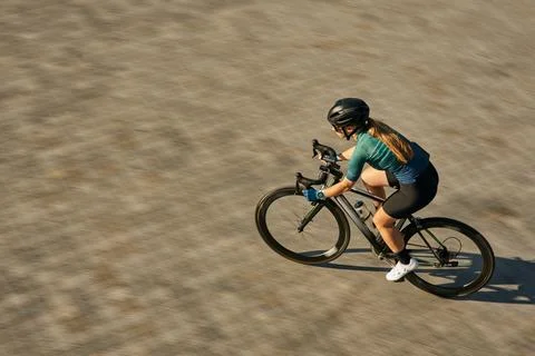 High angle view shot of professional female cyclist in cycling garment and Stock Photos