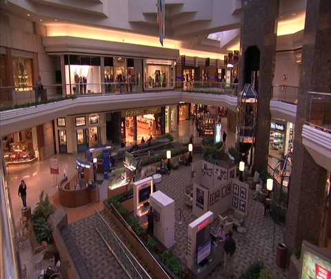 High angle view showing two levels of mall, elevators in background Stock Footage 86748487