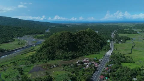 High-angle view shows verdant hills and a river flowing through countryside. Stock Footage 336975697