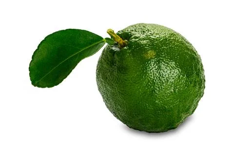 High angle view of single green sour or bitter orange with leaf. Stock-Fotos