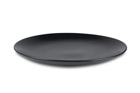 High angle view of single new black empty ceramic plate isolated on white. Stock Photos