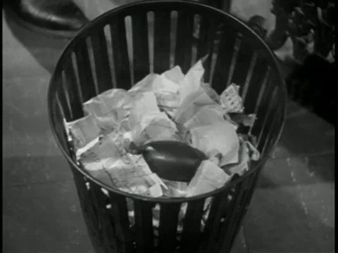 High angle view small explosion in trash can Stock Footage 260248155